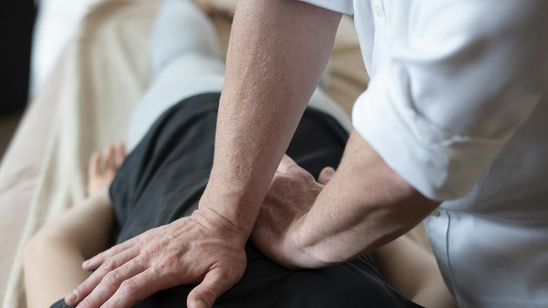 Hands-on spinal decompression technique on a patient back